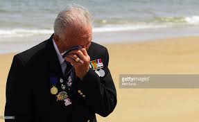 vet crying on Normandy beach